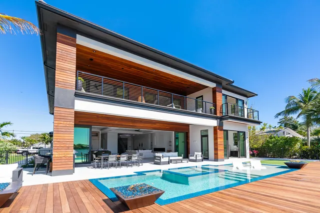 a view of a chairs and table in patio