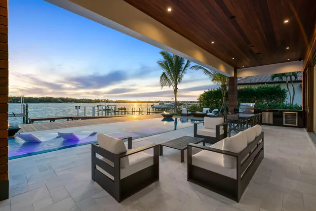 a view of swimming pool with outdoor seating and city view