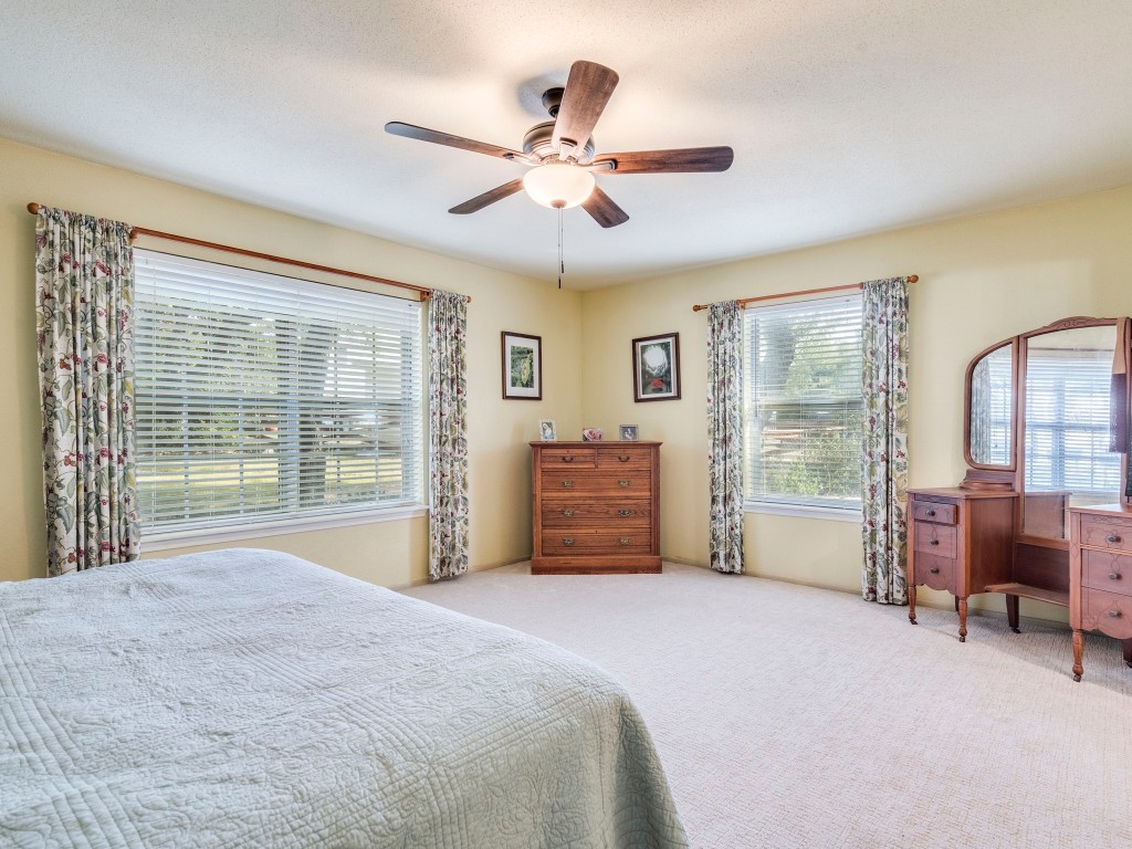 16019 Arbor Trail Buda, TX 78610 - Photo 14 of 40 Large windows for fantastic natural light in the primary bedroom. Check out that totally fresh premium carpet!