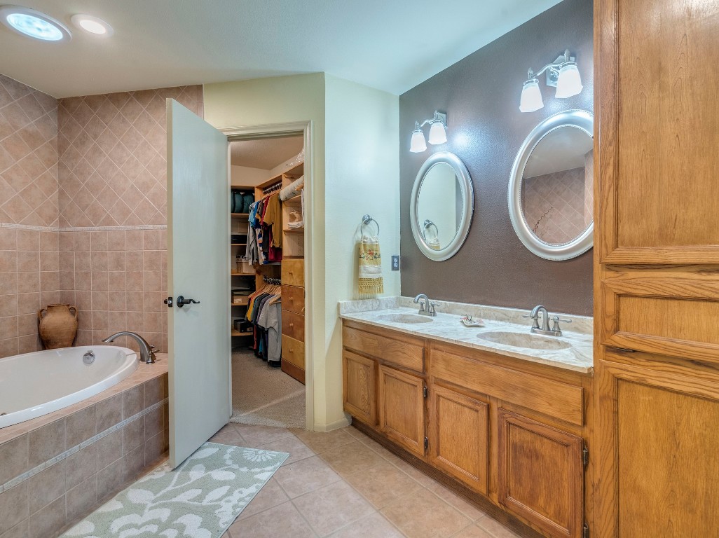 16019 Arbor Trail Buda, TX 78610 - Photo 16 of 40 Jetted tubs provides relaxation after a long, hard day. Double sinks and built in storage keep this area clutter free.