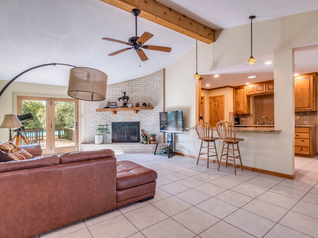 16019 Arbor Trail Buda, TX 78610 - Photo 4 of 40 Light and bright living room with fireplace brings everyone together