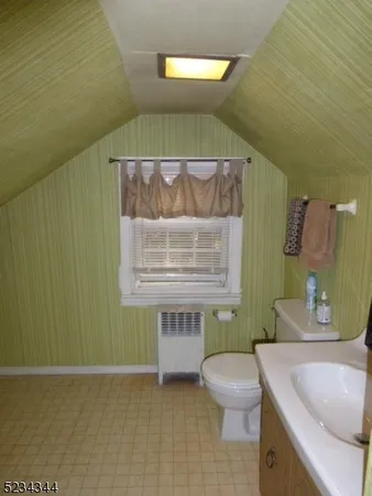a bathroom with a sink a toilet and a bathtub