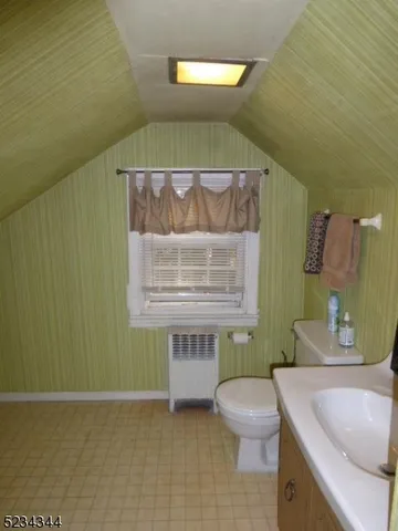 a bathroom with a sink a toilet and a bathtub