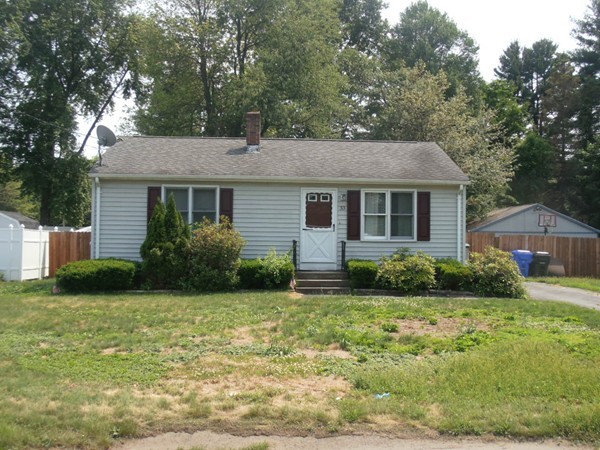 33 Groton Street Springfield, MA 01129 - Photo 1 of 18 a front view of a house with garden