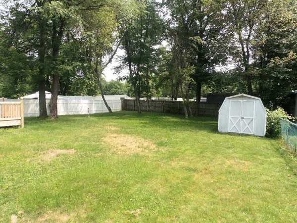 33 Groton Street Springfield, MA 01129 - Photo 3 of 18 a view of a swimming pool with a bench