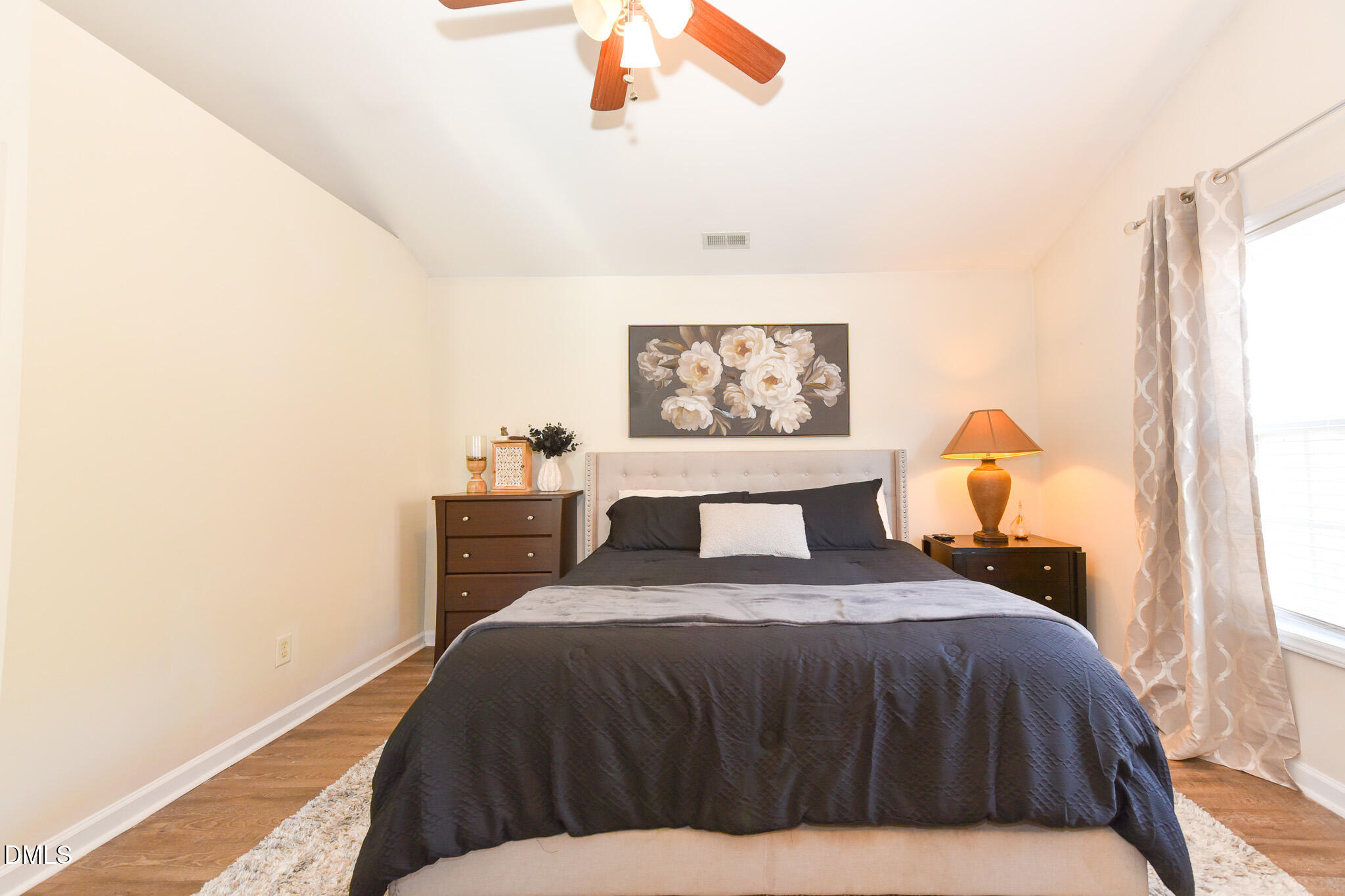 2036 Star Sapphire Drive Raleigh, NC 27610 - Photo 12 of 23 a bedroom with a bed and a window