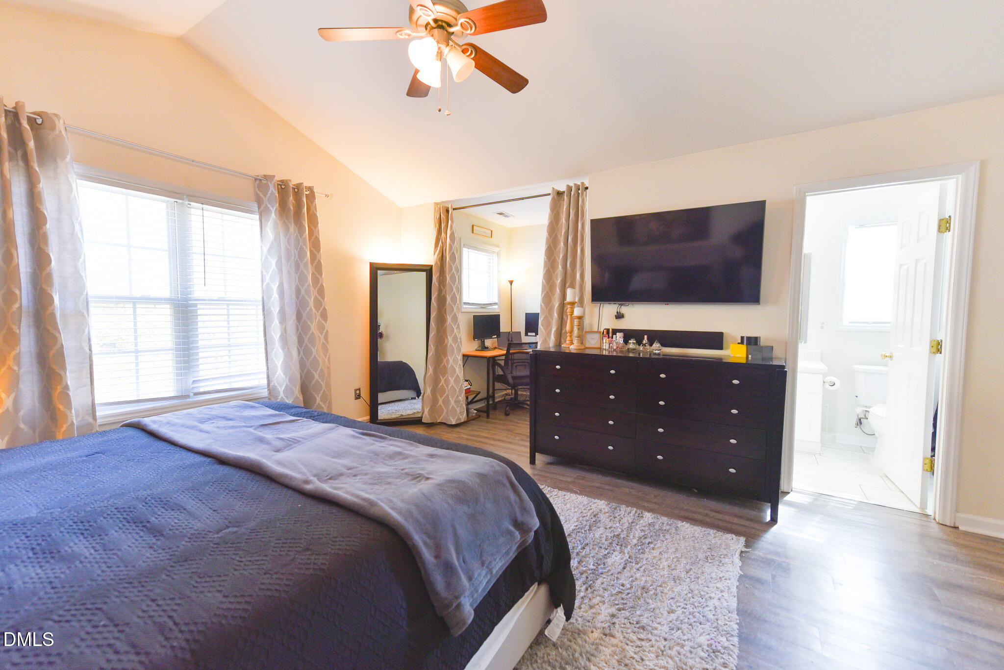 2036 Star Sapphire Drive Raleigh, NC 27610 - Photo 14 of 23 a bedroom with a bed and a flat screen tv