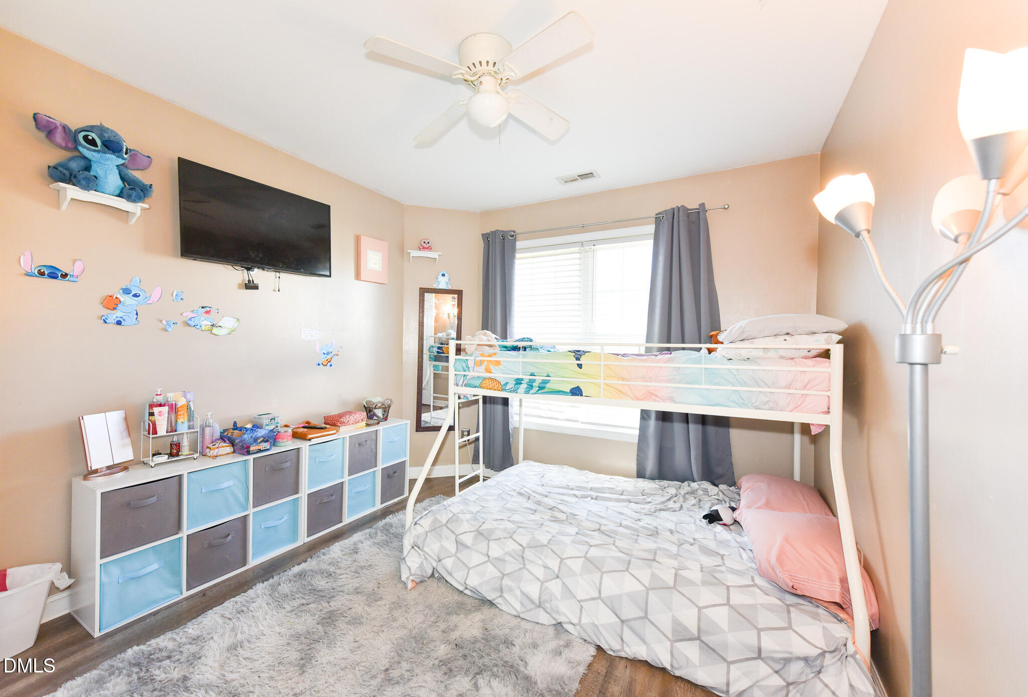 2036 Star Sapphire Drive Raleigh, NC 27610 - Photo 17 of 23 a room with furniture a flat screen tv and white walls
