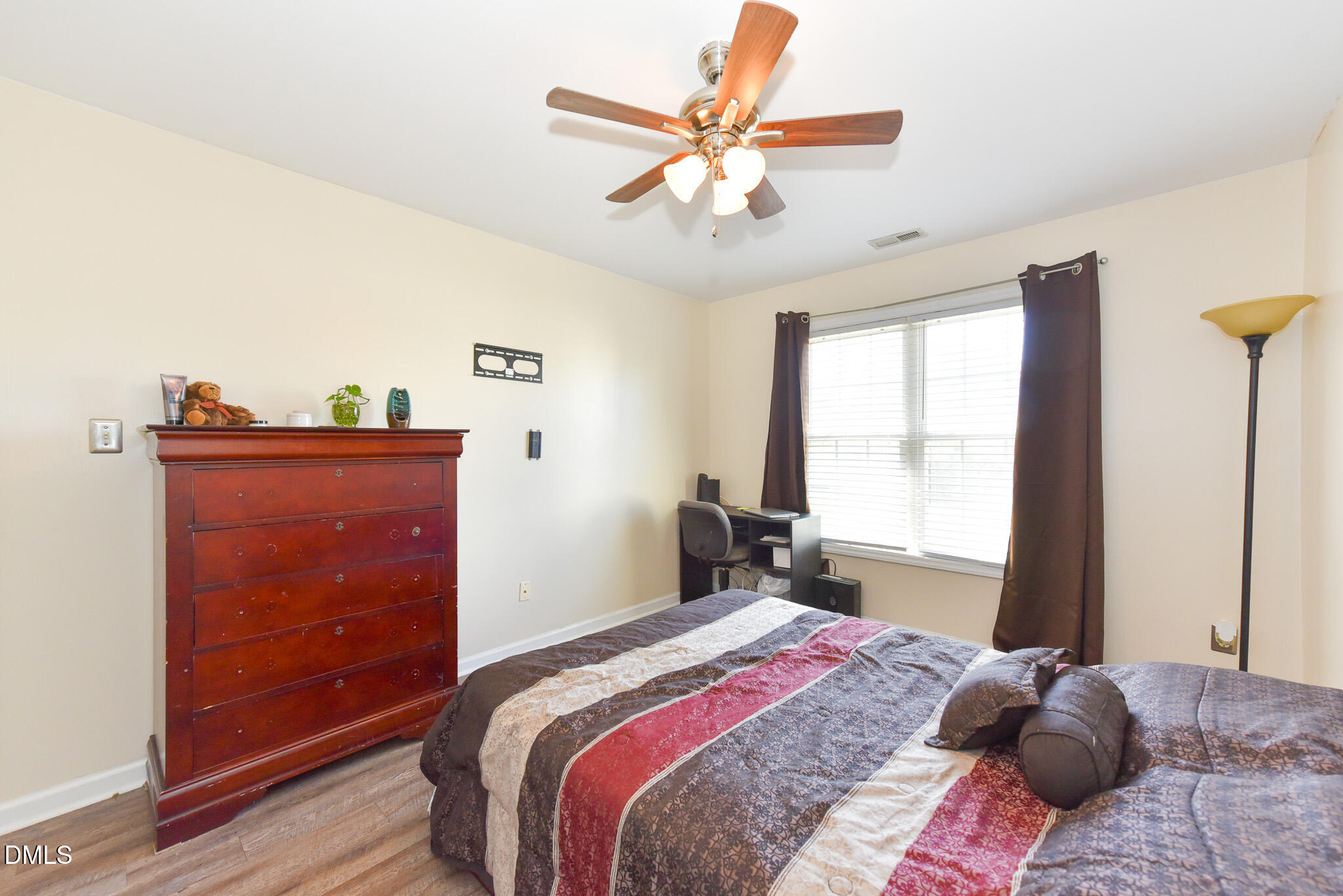 2036 Star Sapphire Drive Raleigh, NC 27610 - Photo 19 of 23 a bedroom with a bed and a window
