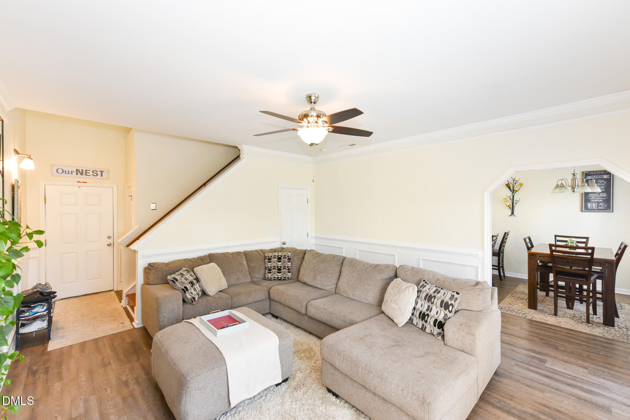 2036 Star Sapphire Drive Raleigh, NC 27610 - Photo 5 of 23 a living room with furniture with wooden floor and a chandelier