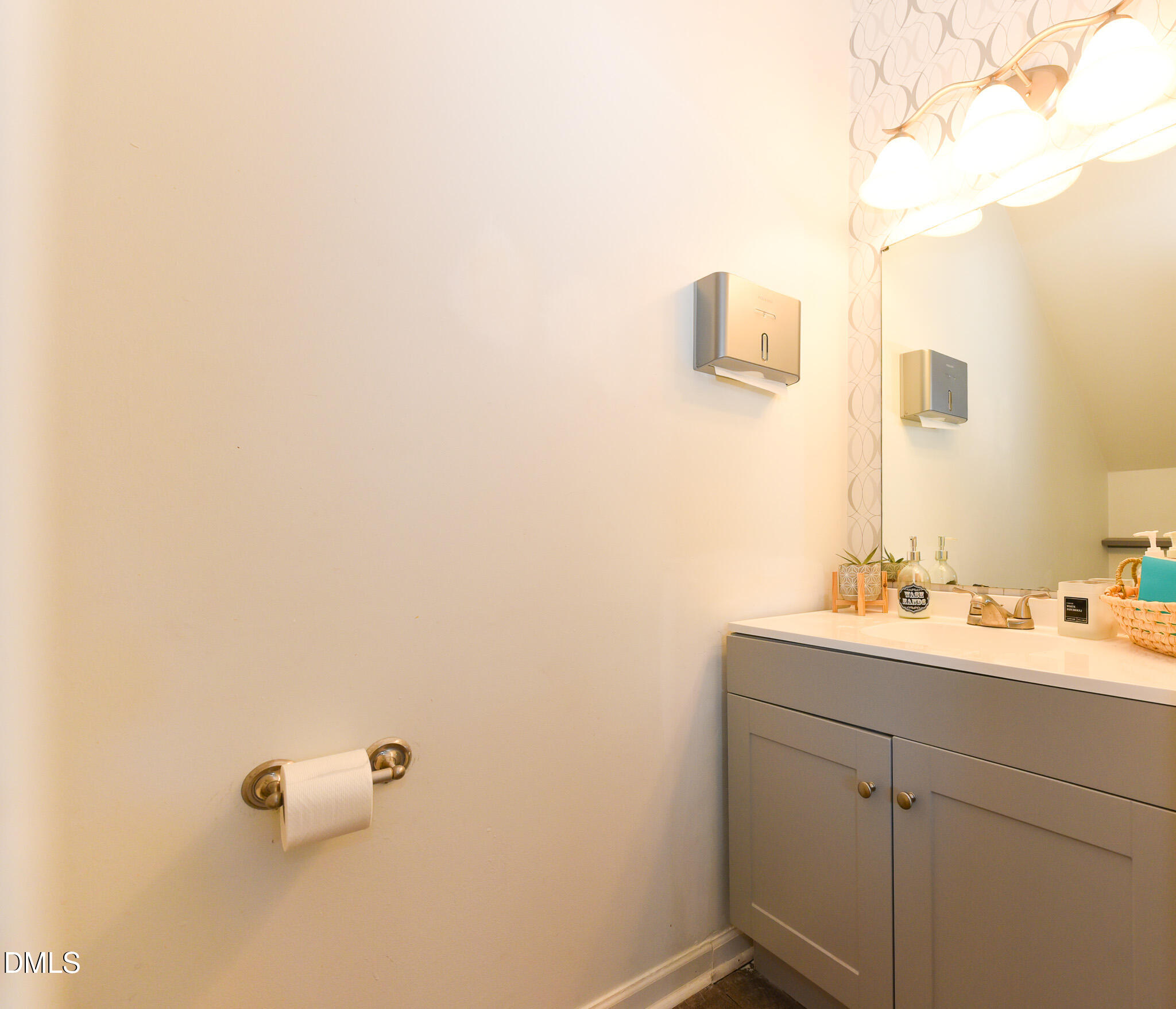 2036 Star Sapphire Drive Raleigh, NC 27610 - Photo 7 of 23 a bathroom with a sink and a mirror