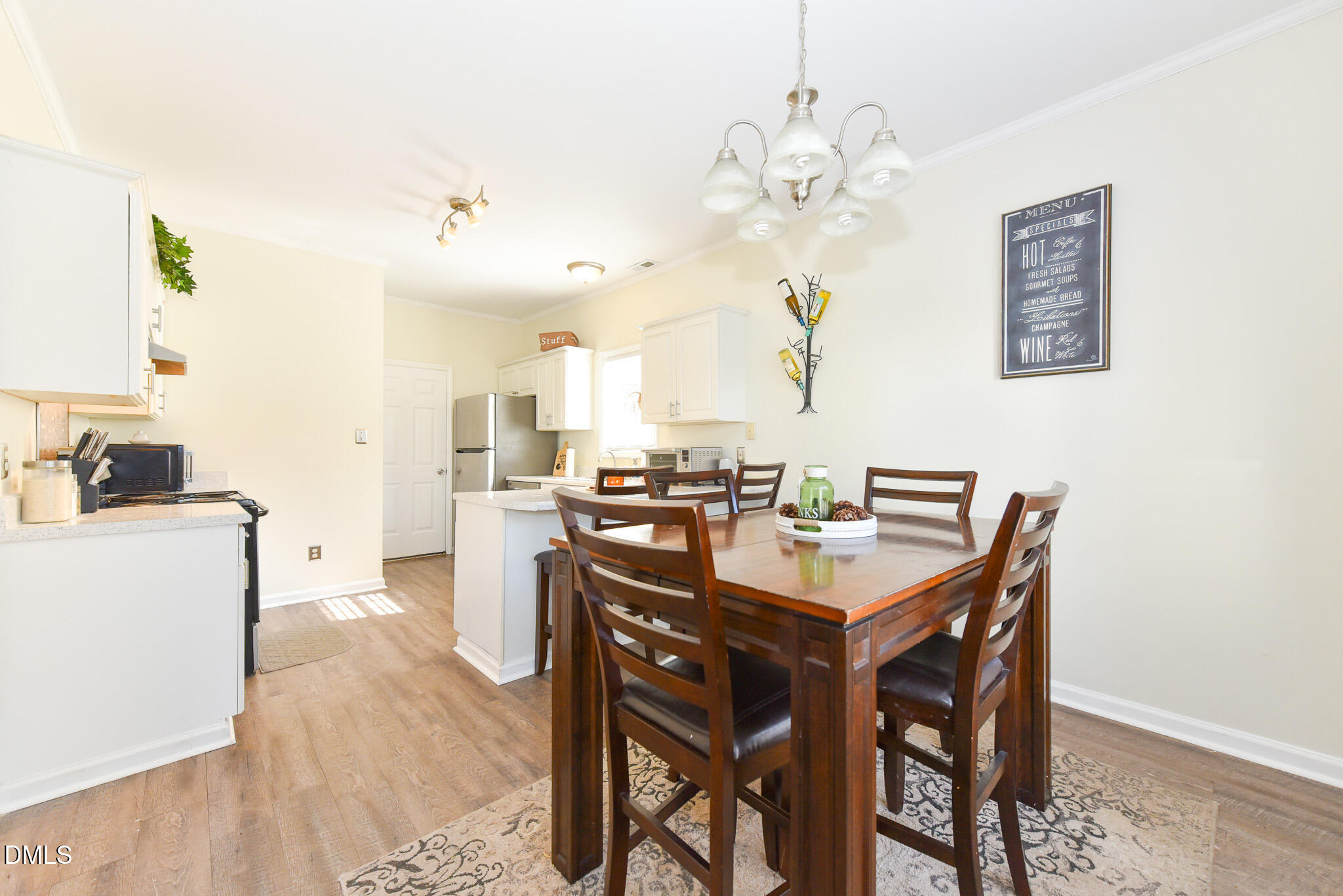 2036 Star Sapphire Drive Raleigh, NC 27610 - Photo 8 of 23 a view of a dining room with furniture and wooden floor