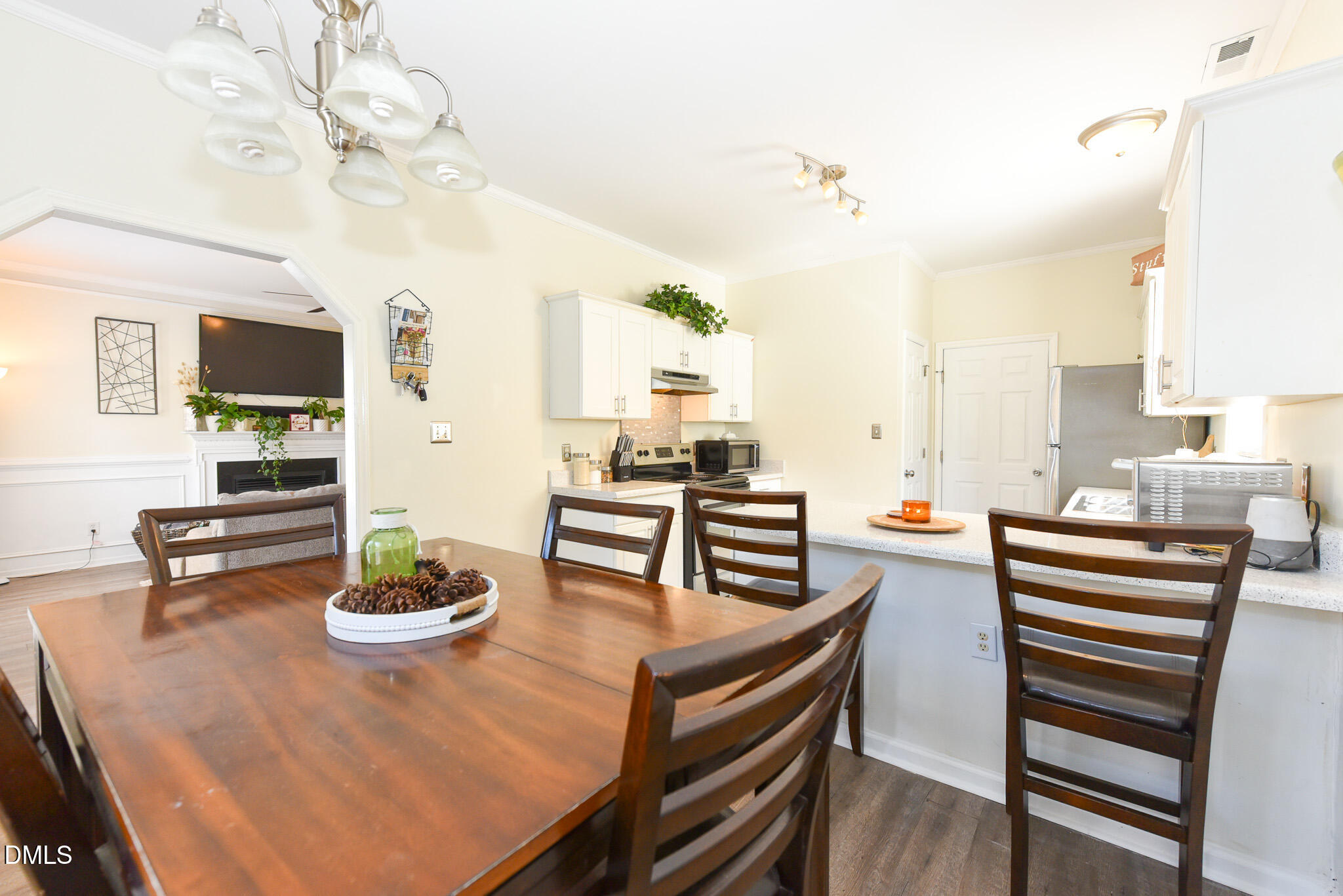 2036 Star Sapphire Drive Raleigh, NC 27610 - Photo 9 of 23 a view of a dining room with furniture and wooden floor