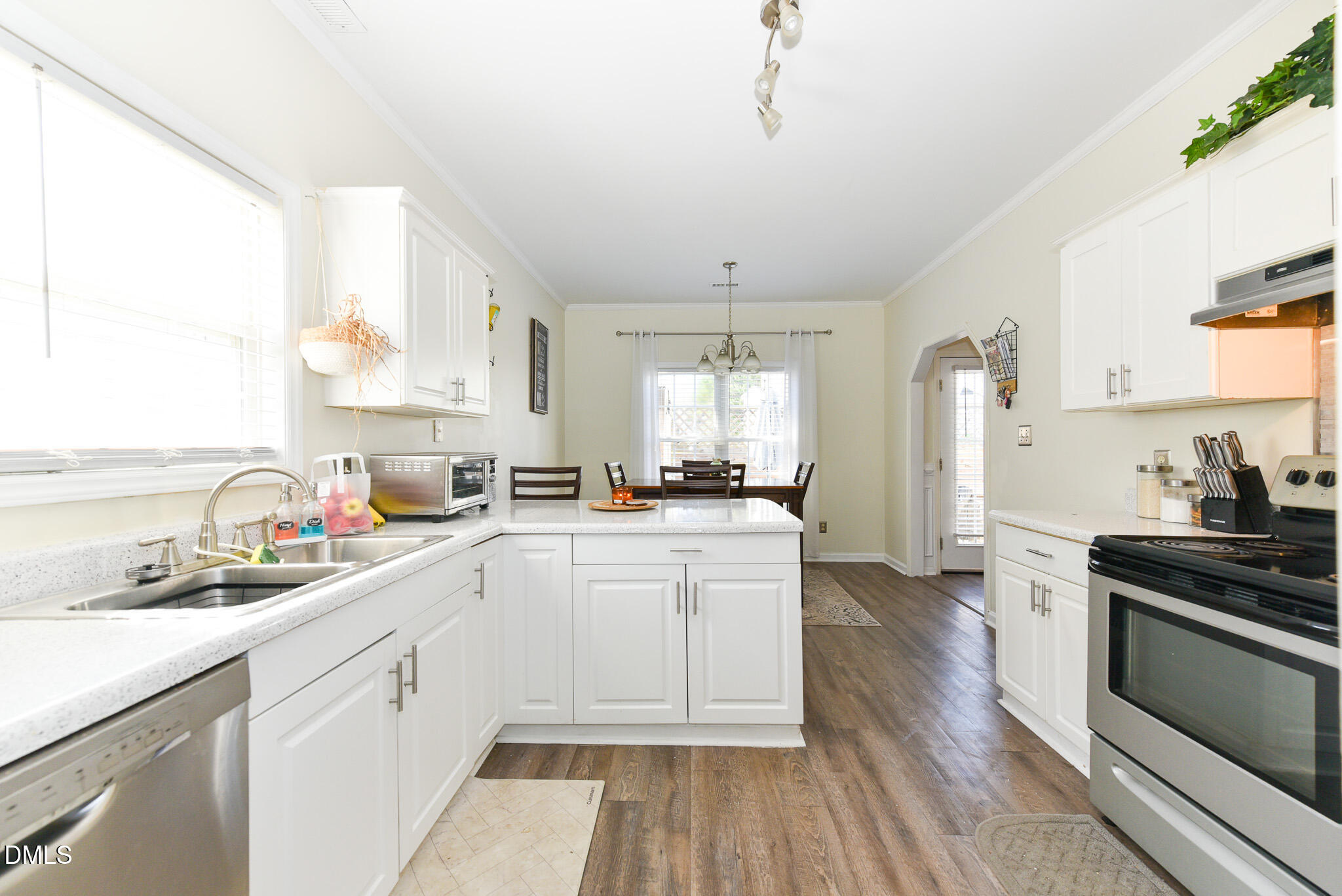 2036 Star Sapphire Drive Raleigh, NC 27610 - Photo 10 of 23 a kitchen with a sink stove and cabinets