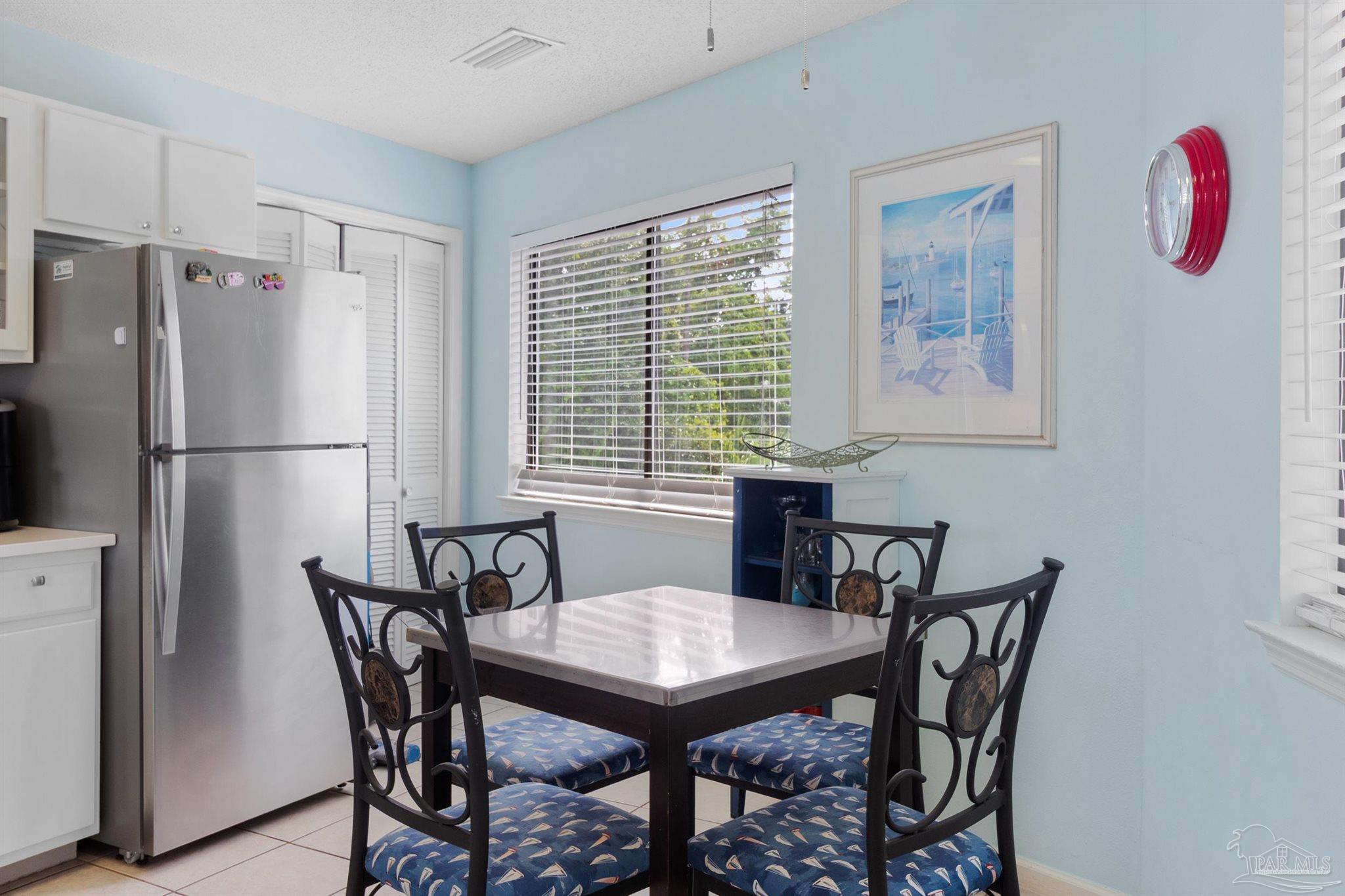 285 Payne Street, Unit 21B Miramar Beach, FL 32550 - Photo 16 of 42 a view of a dining room with furniture
