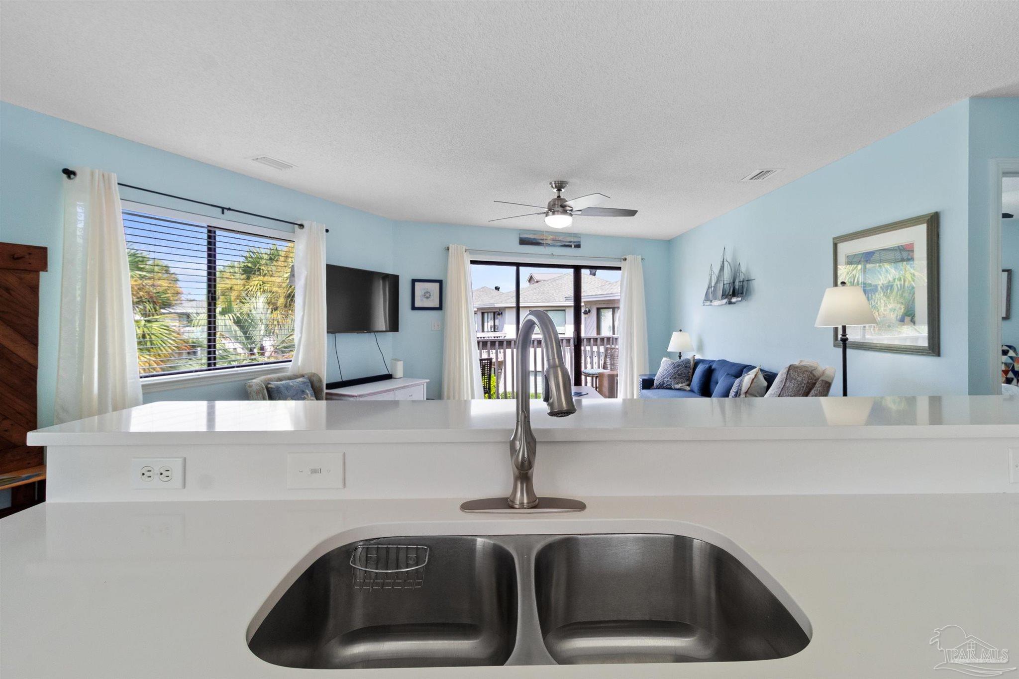 285 Payne Street, Unit 21B Miramar Beach, FL 32550 - Photo 17 of 42 a kitchen with a sink and a window