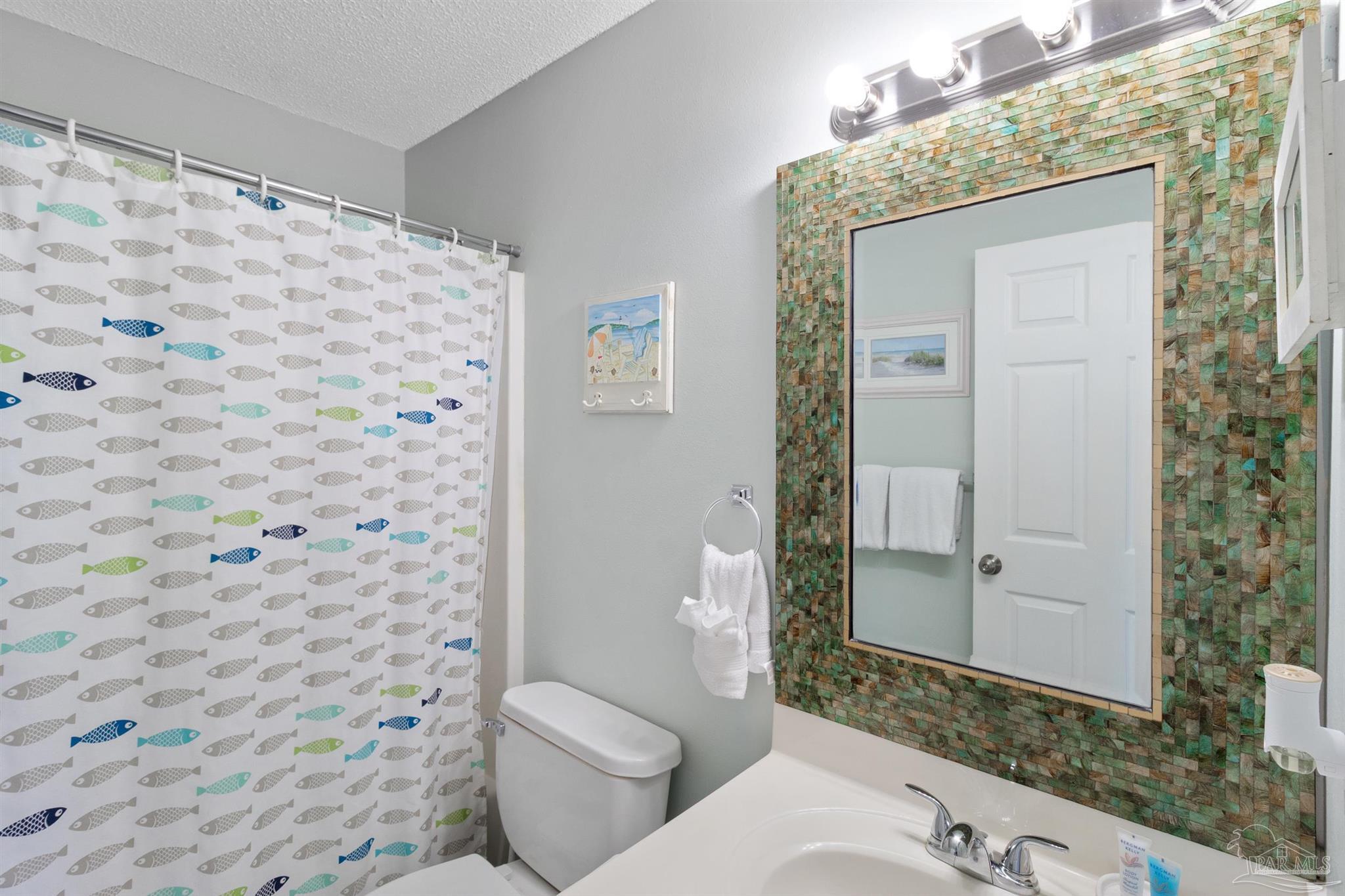 285 Payne Street, Unit 21B Miramar Beach, FL 32550 - Photo 20 of 42 a bathroom with a toilet and a shower
