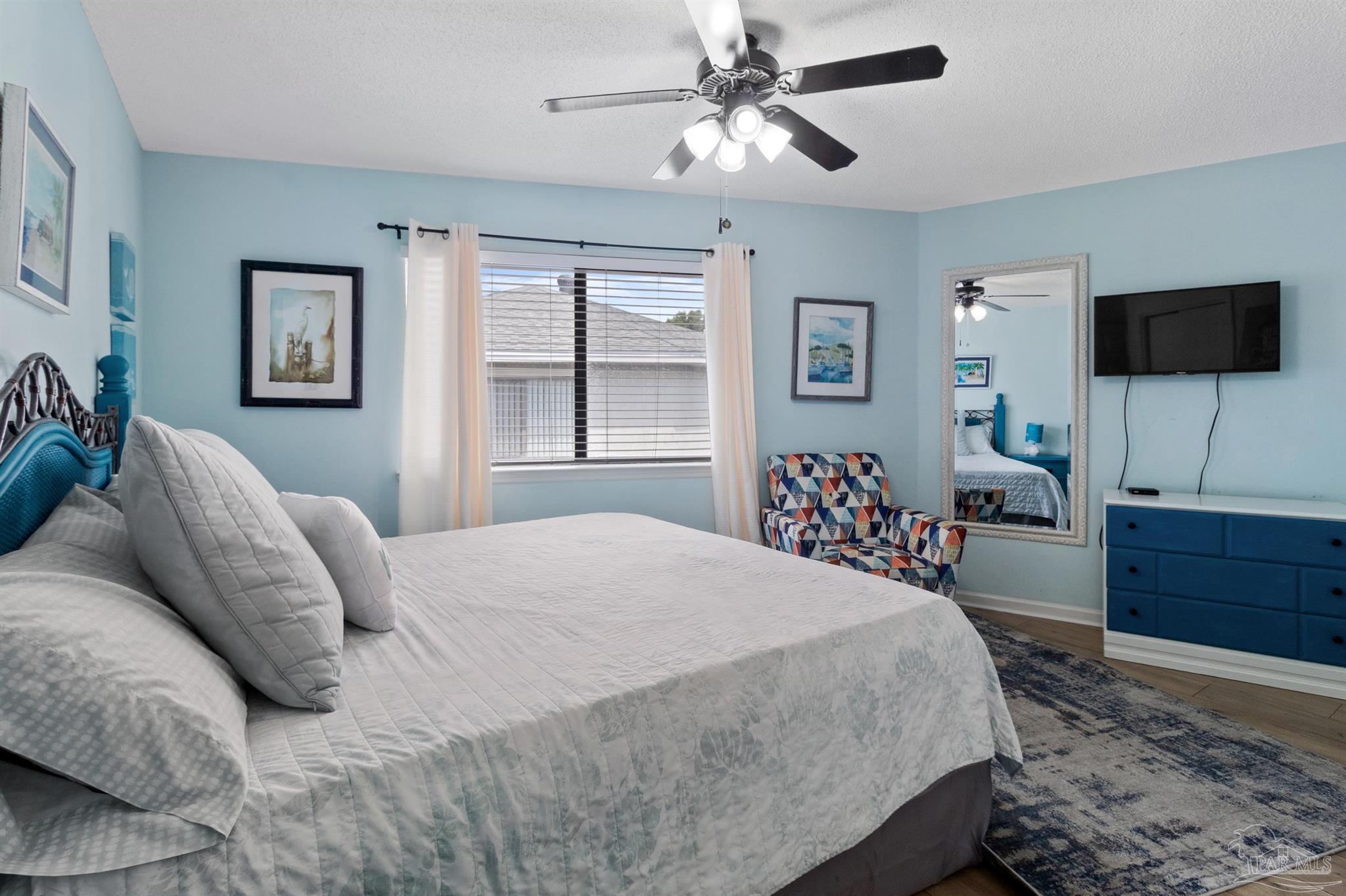 285 Payne Street, Unit 21B Miramar Beach, FL 32550 - Photo 21 of 42 a bedroom with a bed and a flat screen tv
