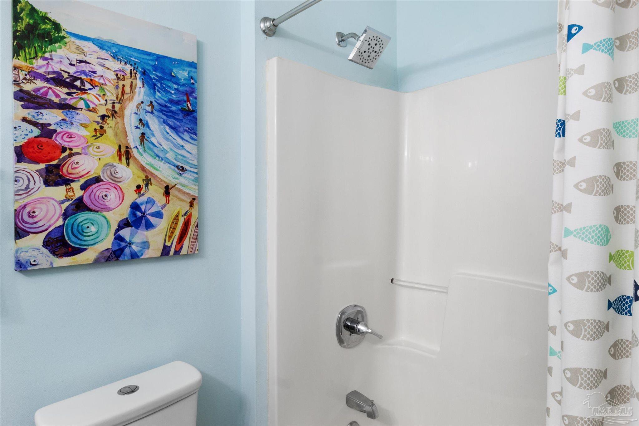 285 Payne Street, Unit 21B Miramar Beach, FL 32550 - Photo 24 of 42 a bathroom with a fan and a shower curtain