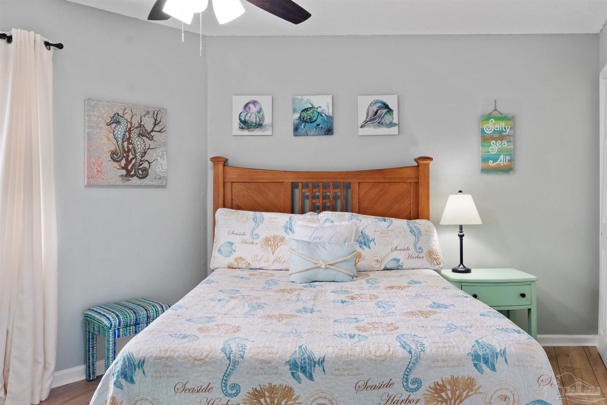 285 Payne Street, Unit 21B Miramar Beach, FL 32550 - Photo 25 of 42 a bedroom with a bed and a painting on the wall