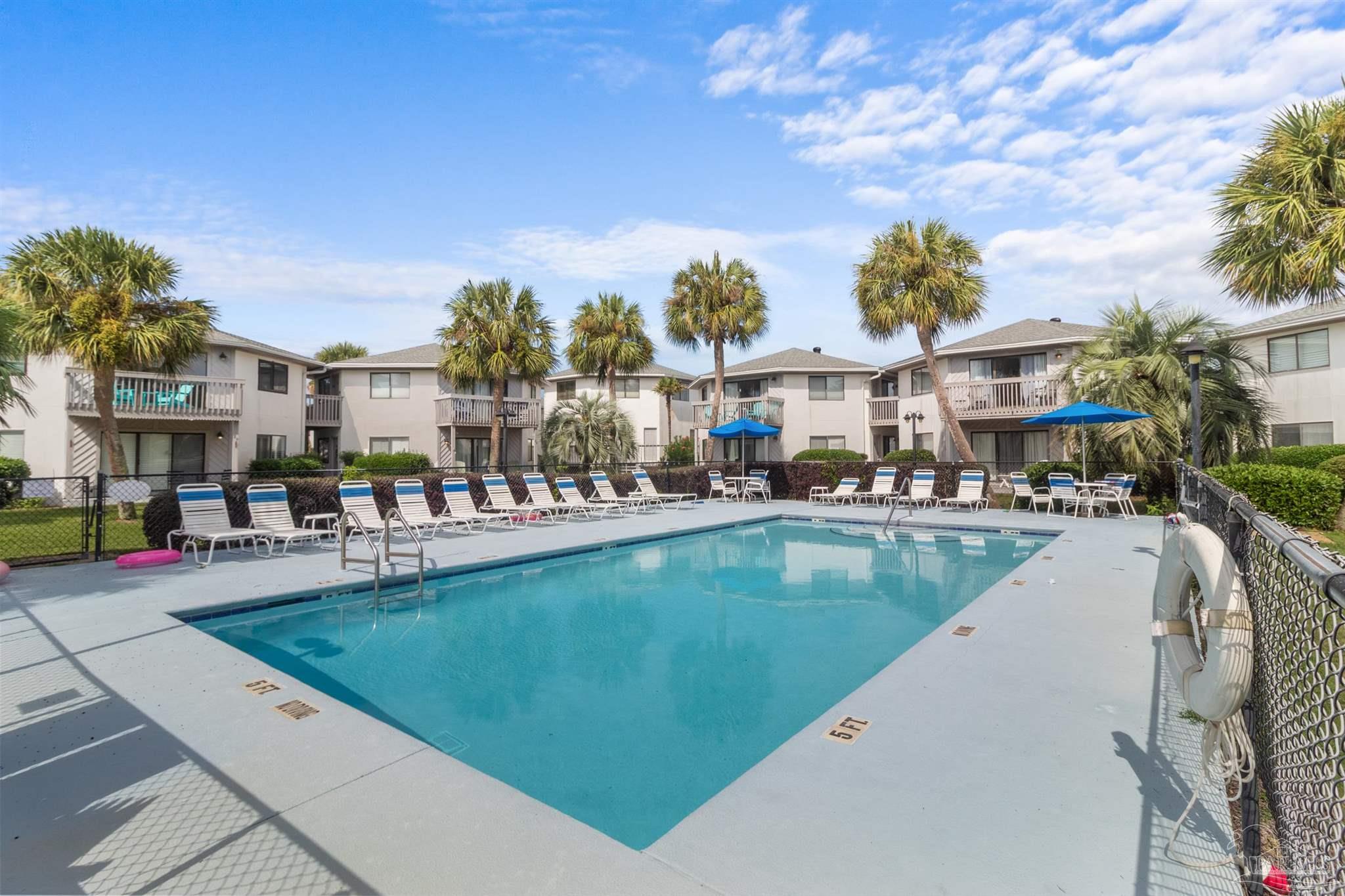285 Payne Street, Unit 21B Miramar Beach, FL 32550 - Photo 32 of 42 a view of a swimming pool with outdoor seating
