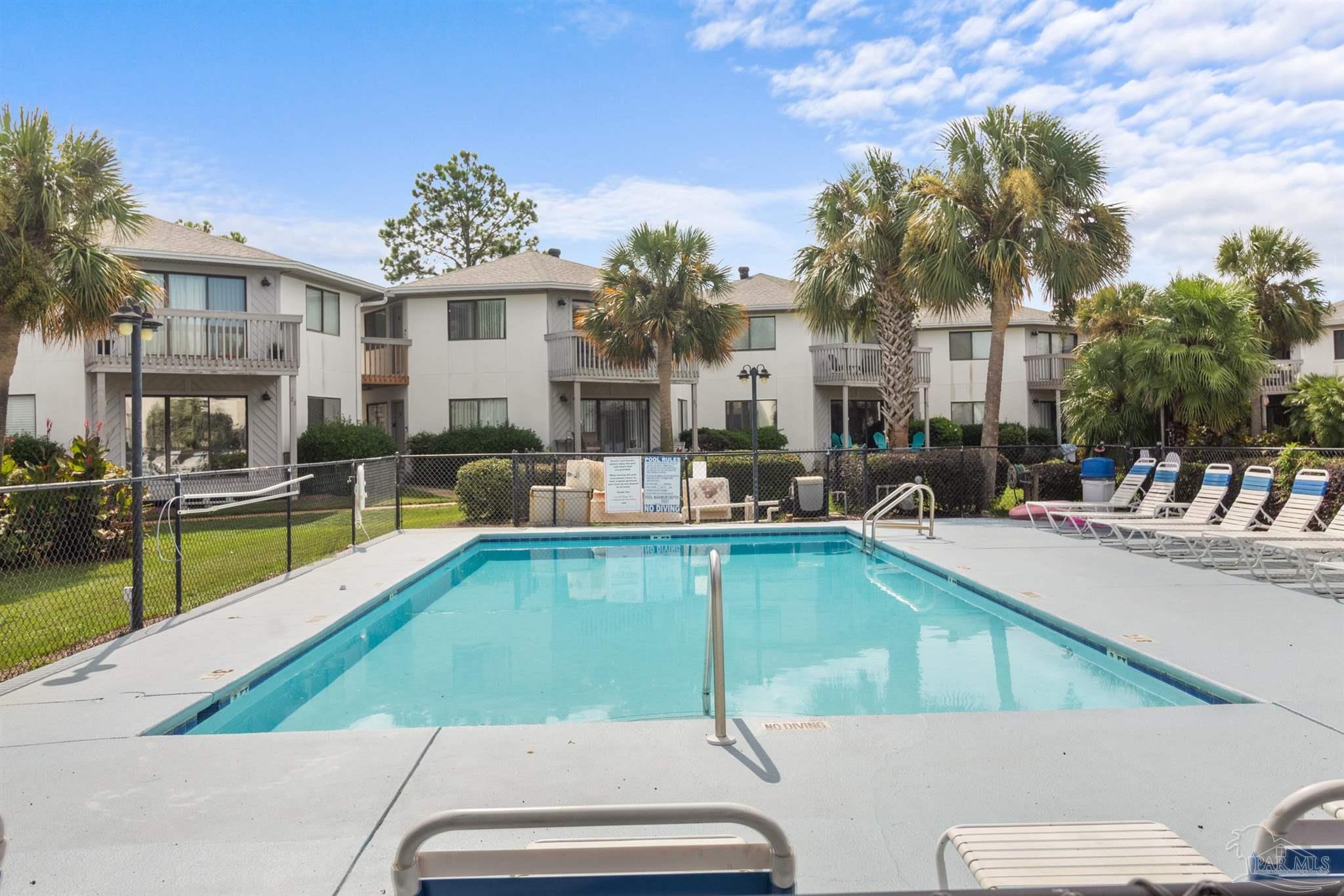 285 Payne Street, Unit 21B Miramar Beach, FL 32550 - Photo 34 of 42 a view of a swimming pool with outdoor seating