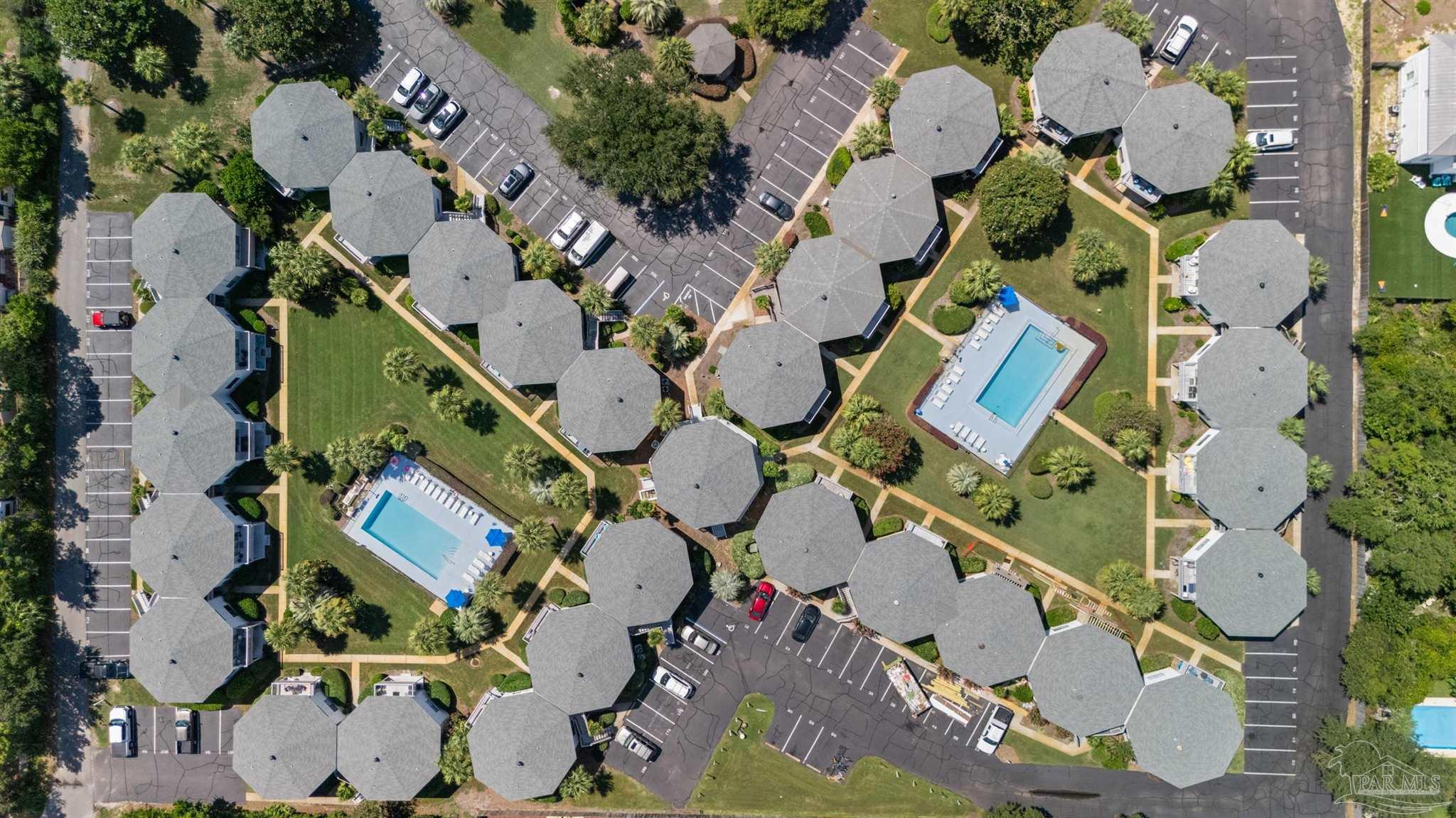 285 Payne Street, Unit 21B Miramar Beach, FL 32550 - Photo 37 of 42 an aerial view of a house with a yard and large trees