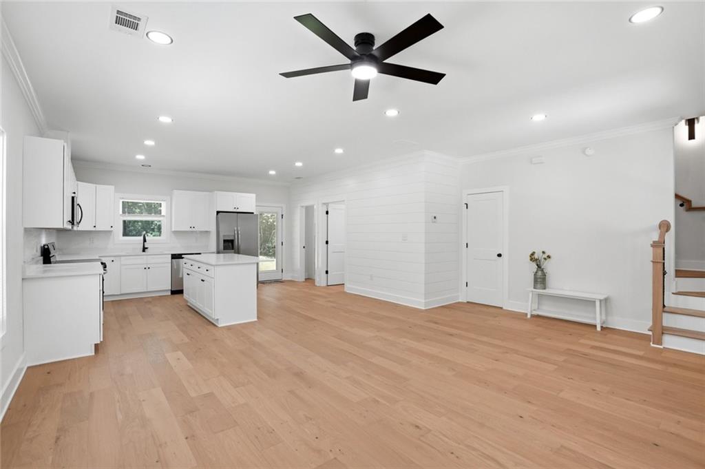 134 Henry Meyer Road Winterville, GA 30683 - Photo 7 of 34 a big room with kitchen view and a refrigerator