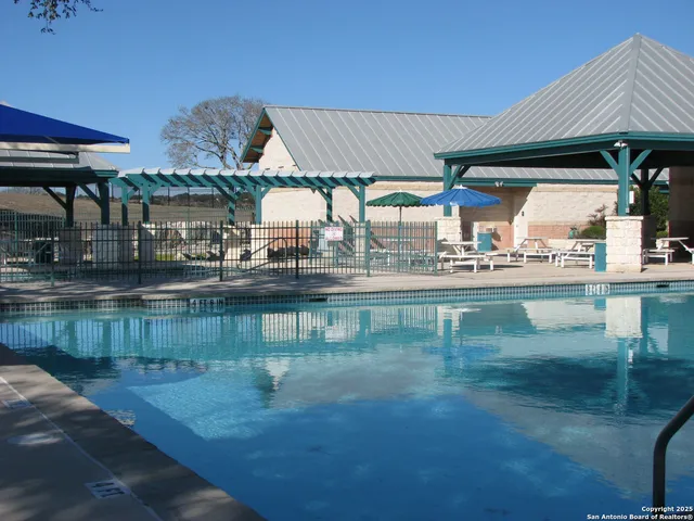 a kitchen with a table and chairs in it