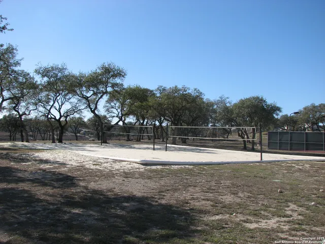 a swimming pool with wooden fence