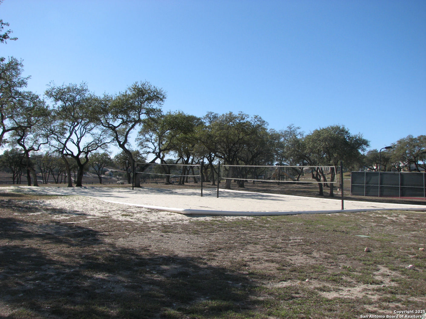 233 Rosinweed Drive Spring Branch, TX 78070 - Photo 16 of 17 a swimming pool with wooden fence
