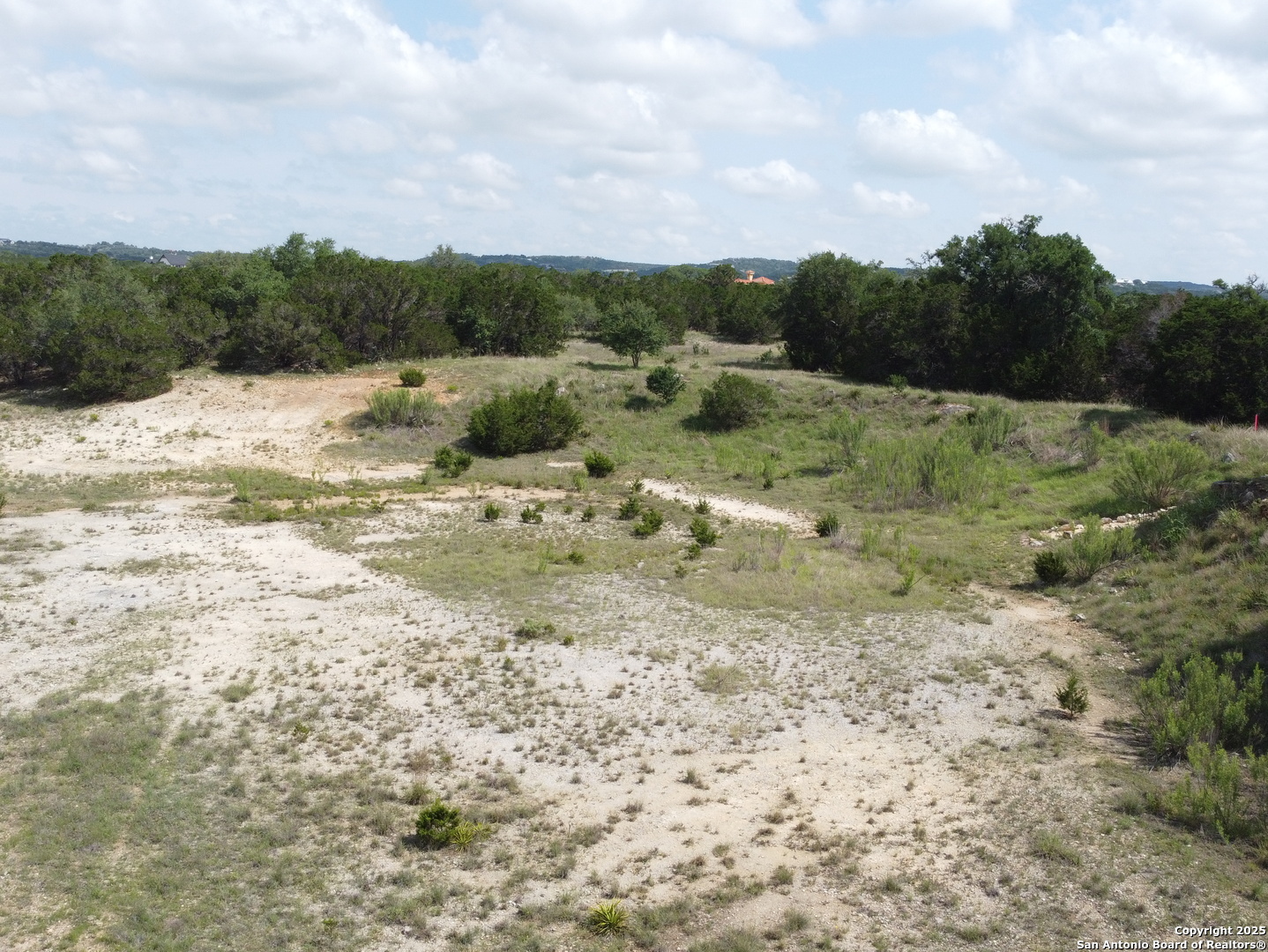 233 Rosinweed Drive Spring Branch, TX 78070 - Photo 4 of 17 a view of a lake view with houses in the back