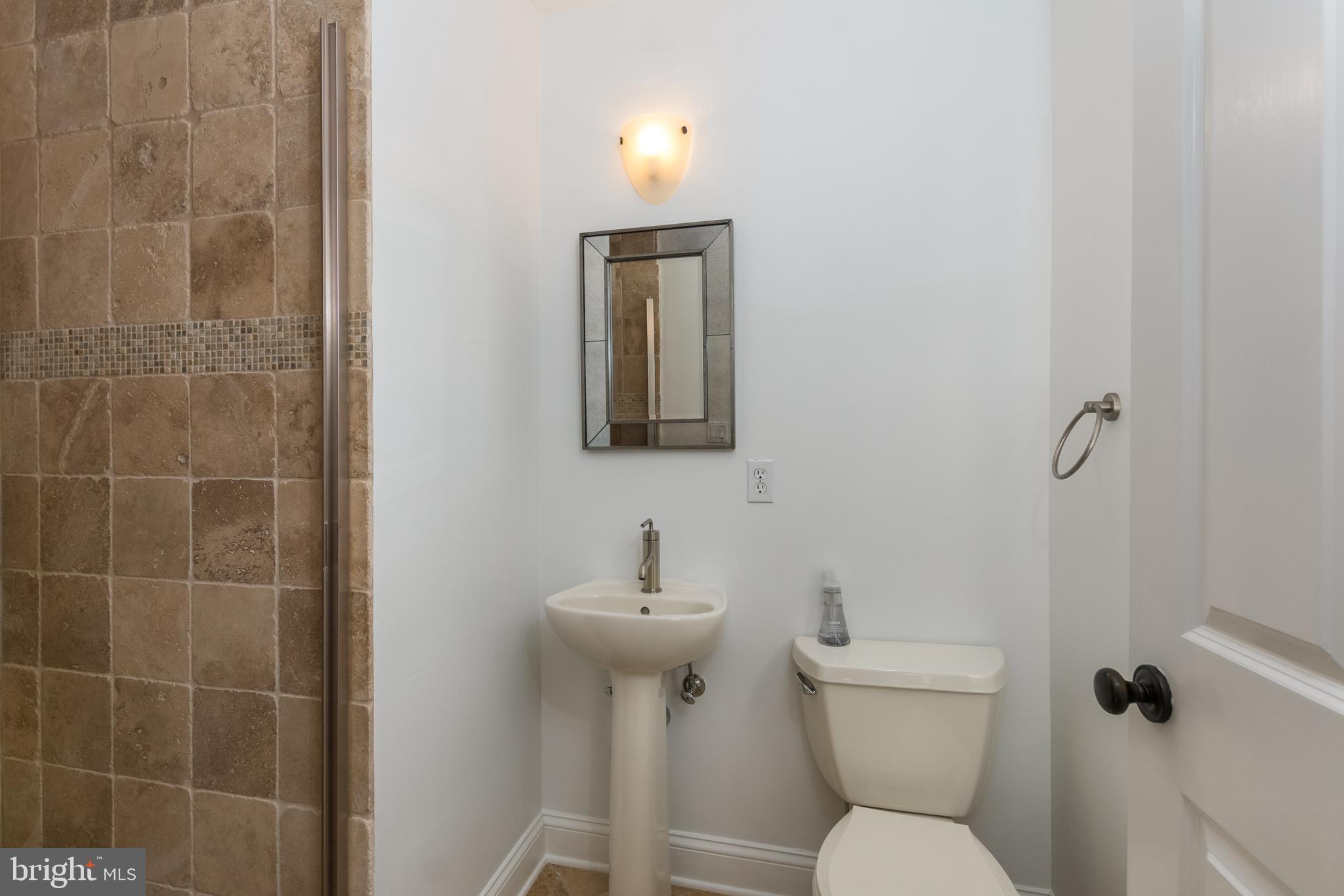 50 Pardoe Road Princeton, NJ 08540 - Photo 20 of 34 a bathroom with a toilet sink and mirror