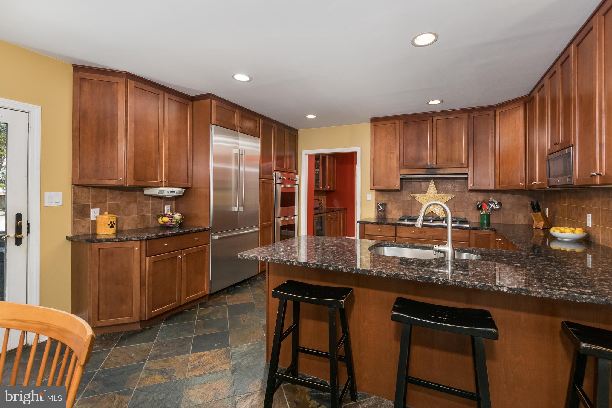 50 Pardoe Road Princeton, NJ 08540 - Photo 8 of 34 a kitchen with stainless steel appliances granite countertop a stove a sink a microwave a refrigerator and cabinets