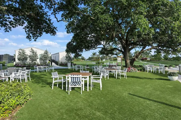 a table and chairs in the garden