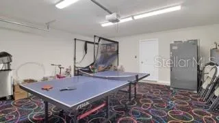 a room with table and chairs