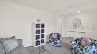 a living room with furniture and decor