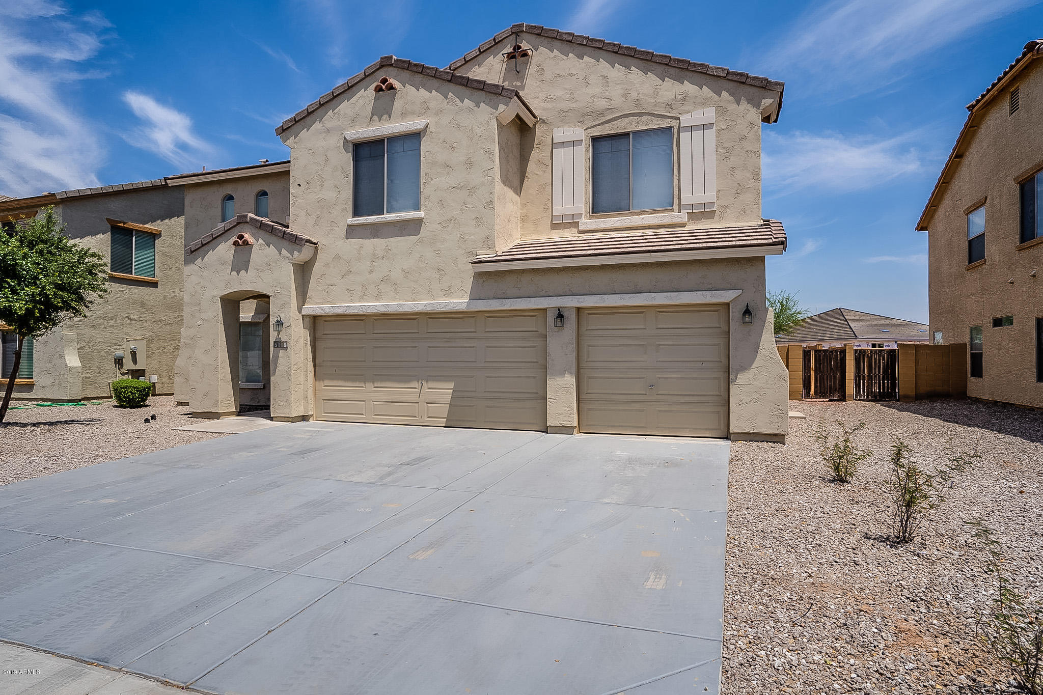 5118 West Apollo Road Laveen, AZ 85339 - Photo 3 of 57 a front view of a house with a yard