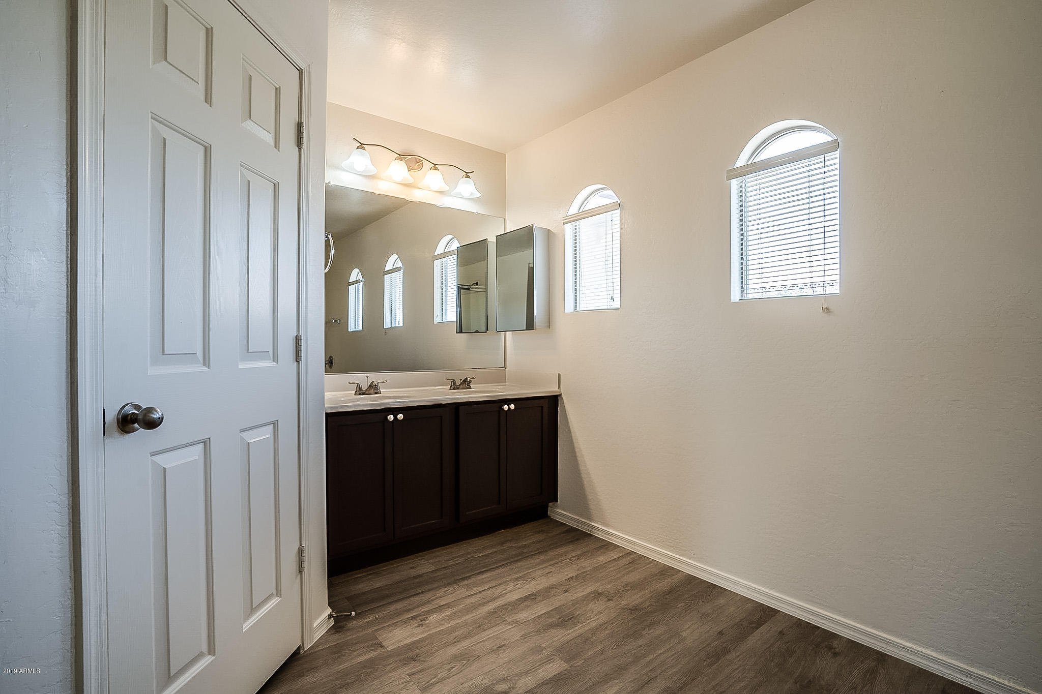 5118 West Apollo Road Laveen, AZ 85339 - Photo 44 of 57 a bathroom with a granite countertop sink and mirror