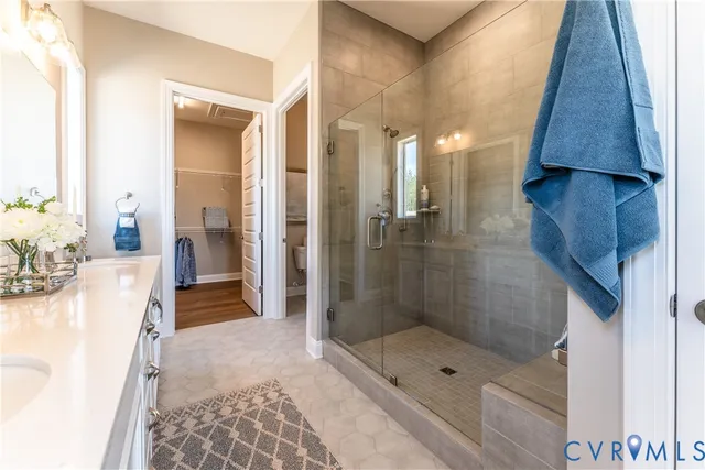 a bathroom with a shower and a sink