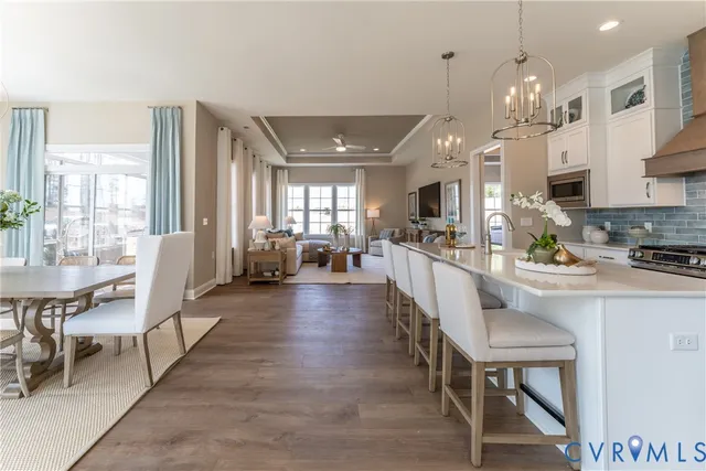 a large kitchen with a table and chairs