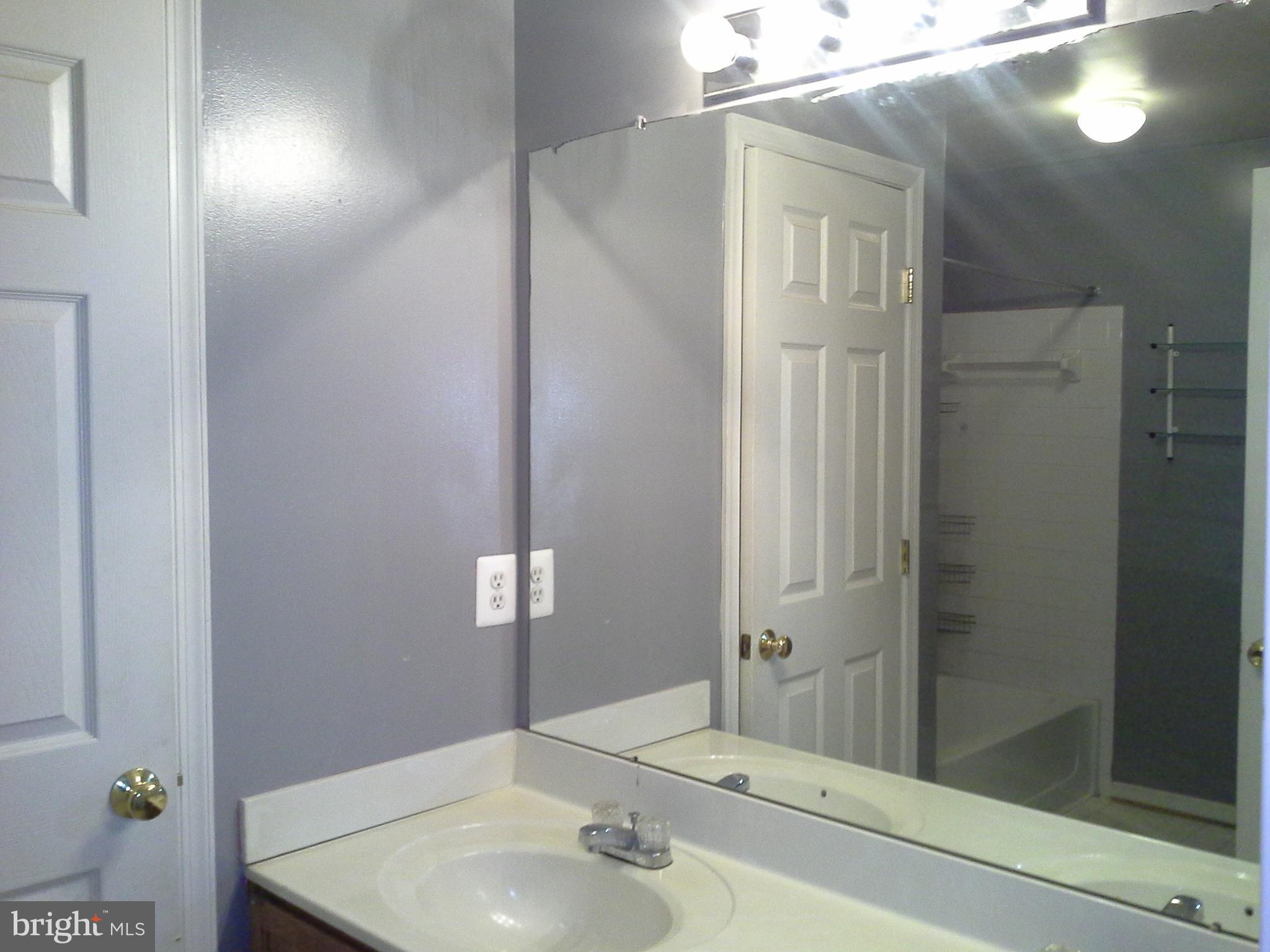 206 Arcadia Shores Circle Odenton, MD 21113 - Photo 3 of 5 a bathroom with a sink and a mirror