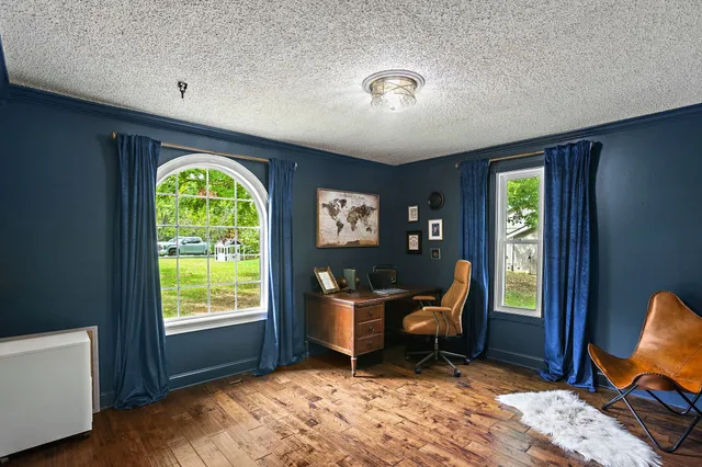 a bedroom with two beds and a window