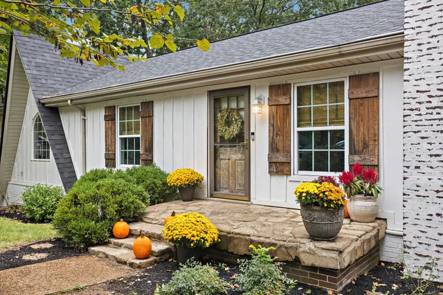 a front view of a house with an outdoor seating