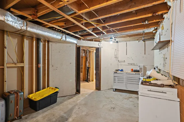 a view of a livingroom with furniture wooden floor and next to a window