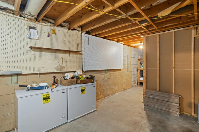 an aerial view of a house with a yard basket ball court and outdoor seating