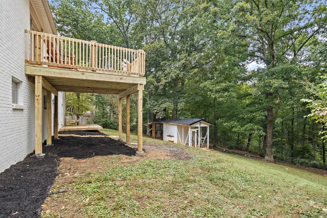 a view of a city with lush green forest