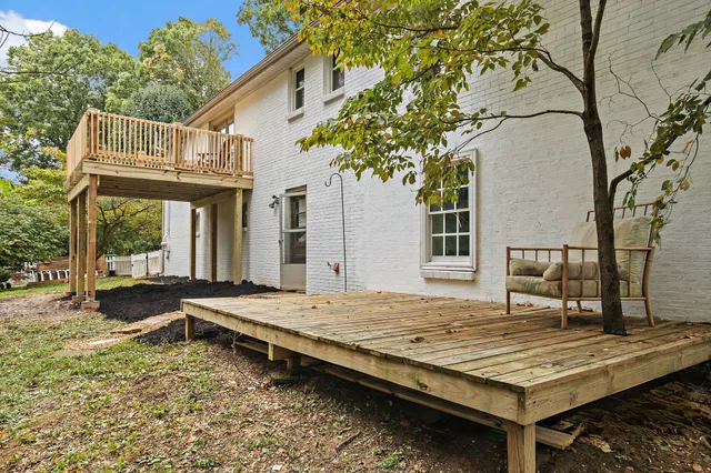 view of a city with lush green forest