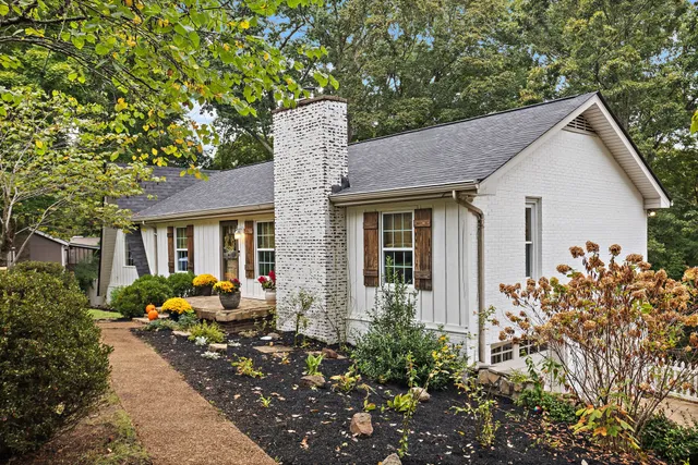a front view of a house with garden