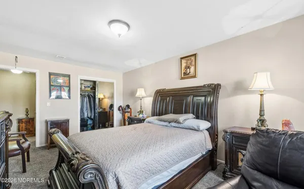 a bed room with a bed and a lamp